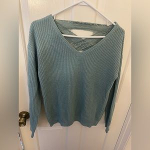 Women’s size small v neck sweater with lace detail on back